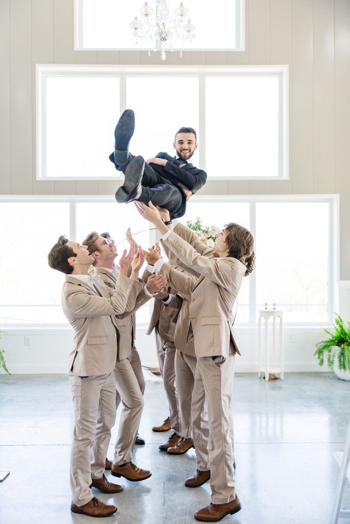 Groomsmen throwing Groom up Tulsa Oklahoma