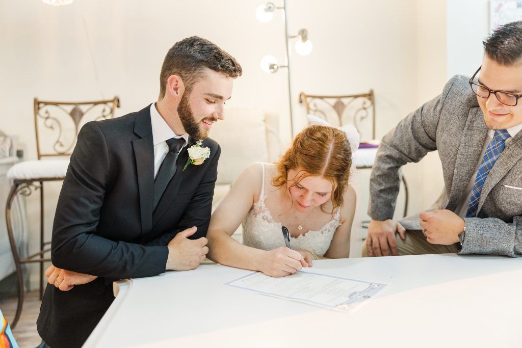 Tulsa Couple signing their marriage license in our beautiful bride's suite 