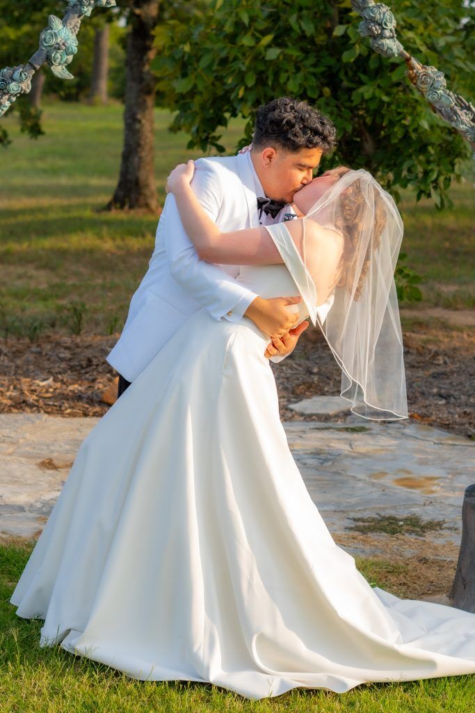 Celebrating after wedding near Tulsa OK  with bent back kiss